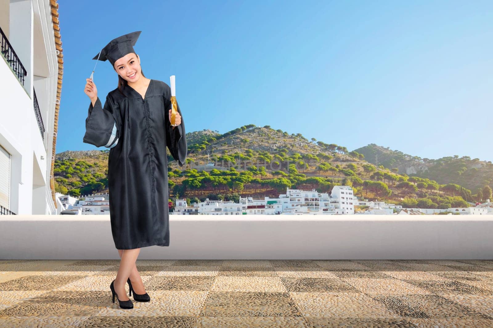 Pretty asian woman with graduation cap and diploma scroll on graduation ceremony