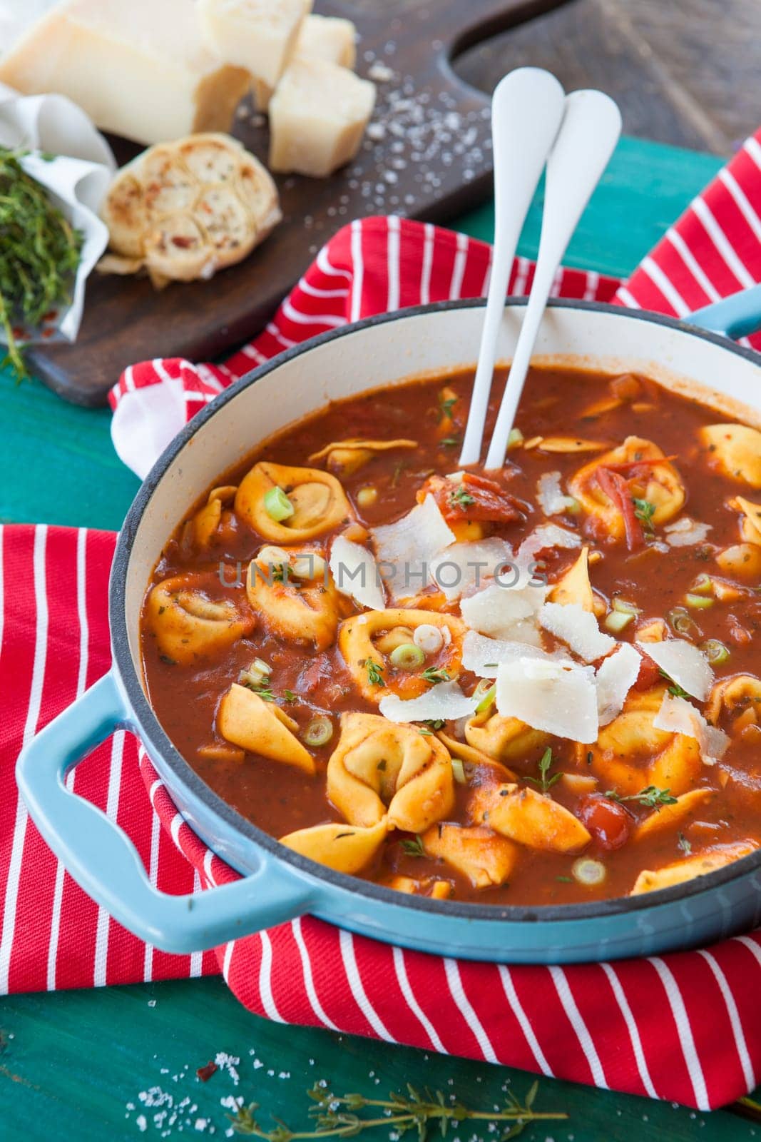Delicious tortellini in a tomato sauce / soup in a pan