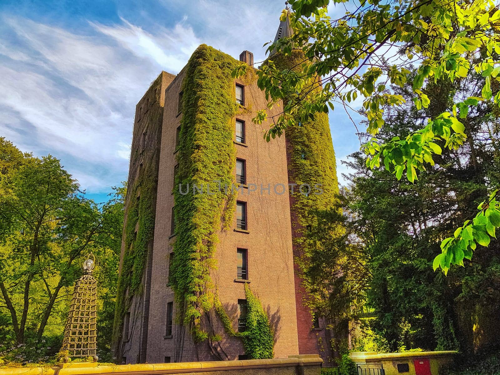 Flat high brick house block with tower