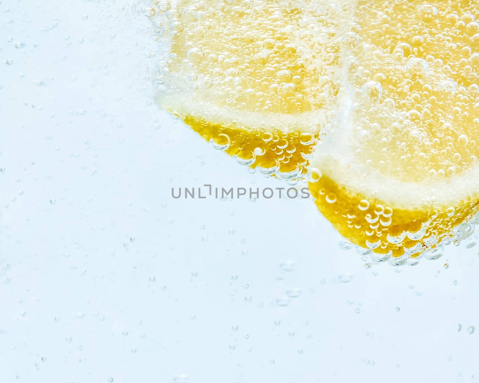 in soda, two slices of fresh juicy lemon.