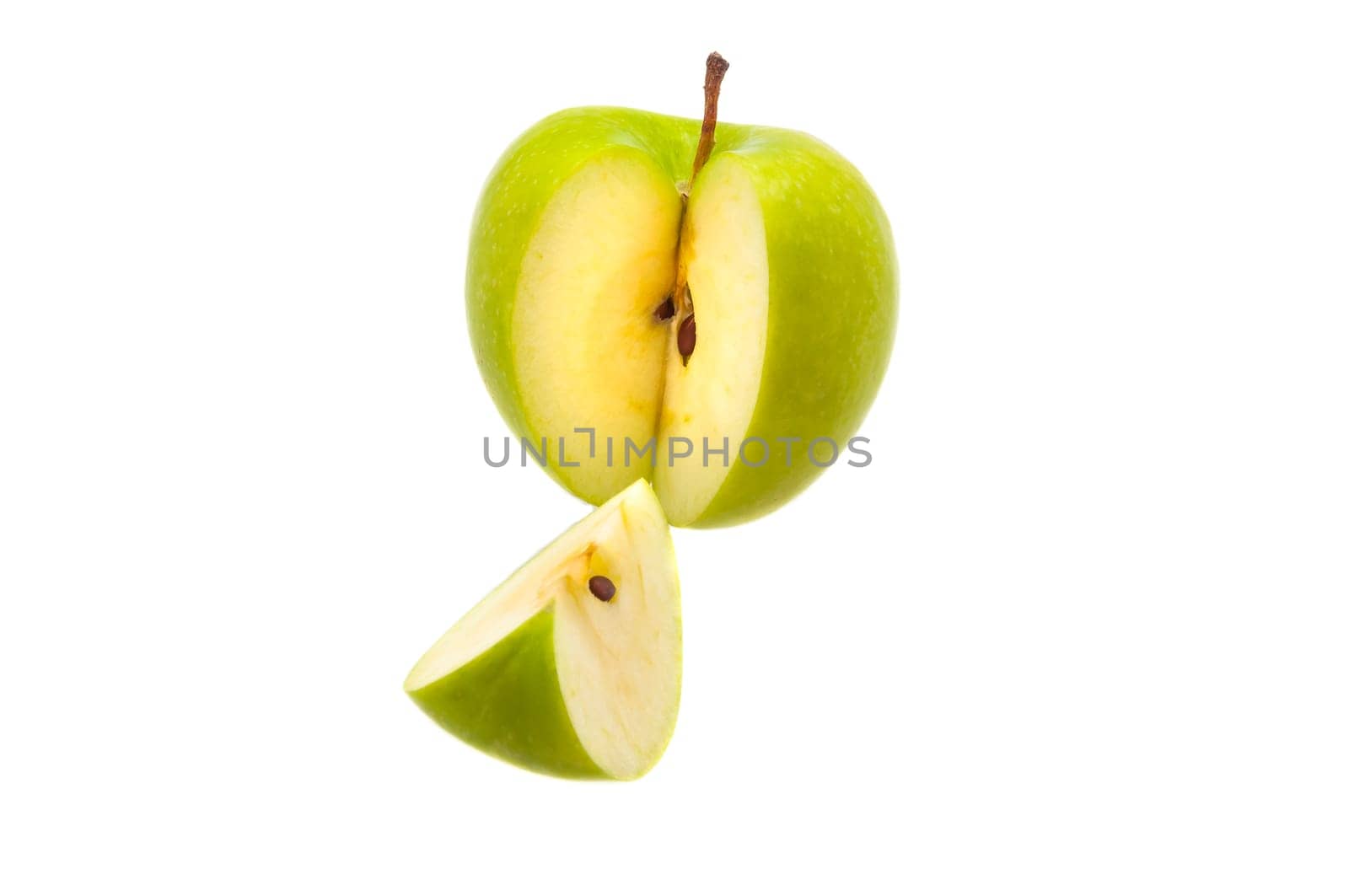 Slice is cut off from a large fresh green apple. Isolated.