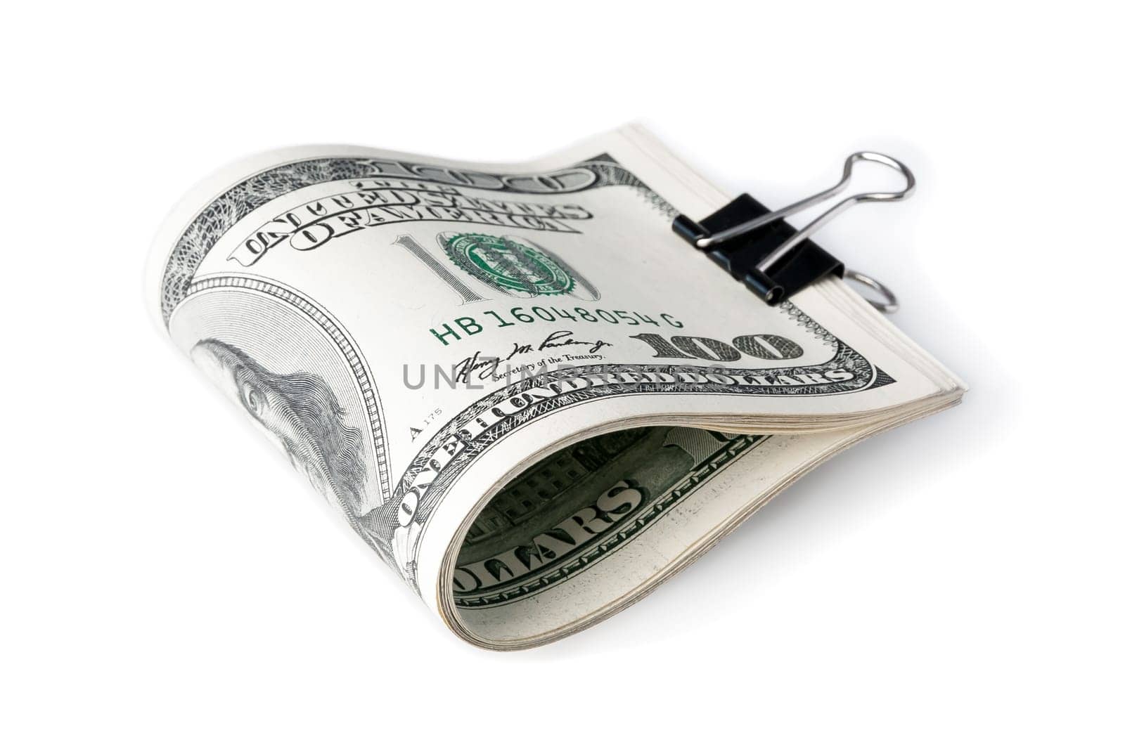 A pack of American one hundred dollar bills folded in half and fastened with a clerical clasp.