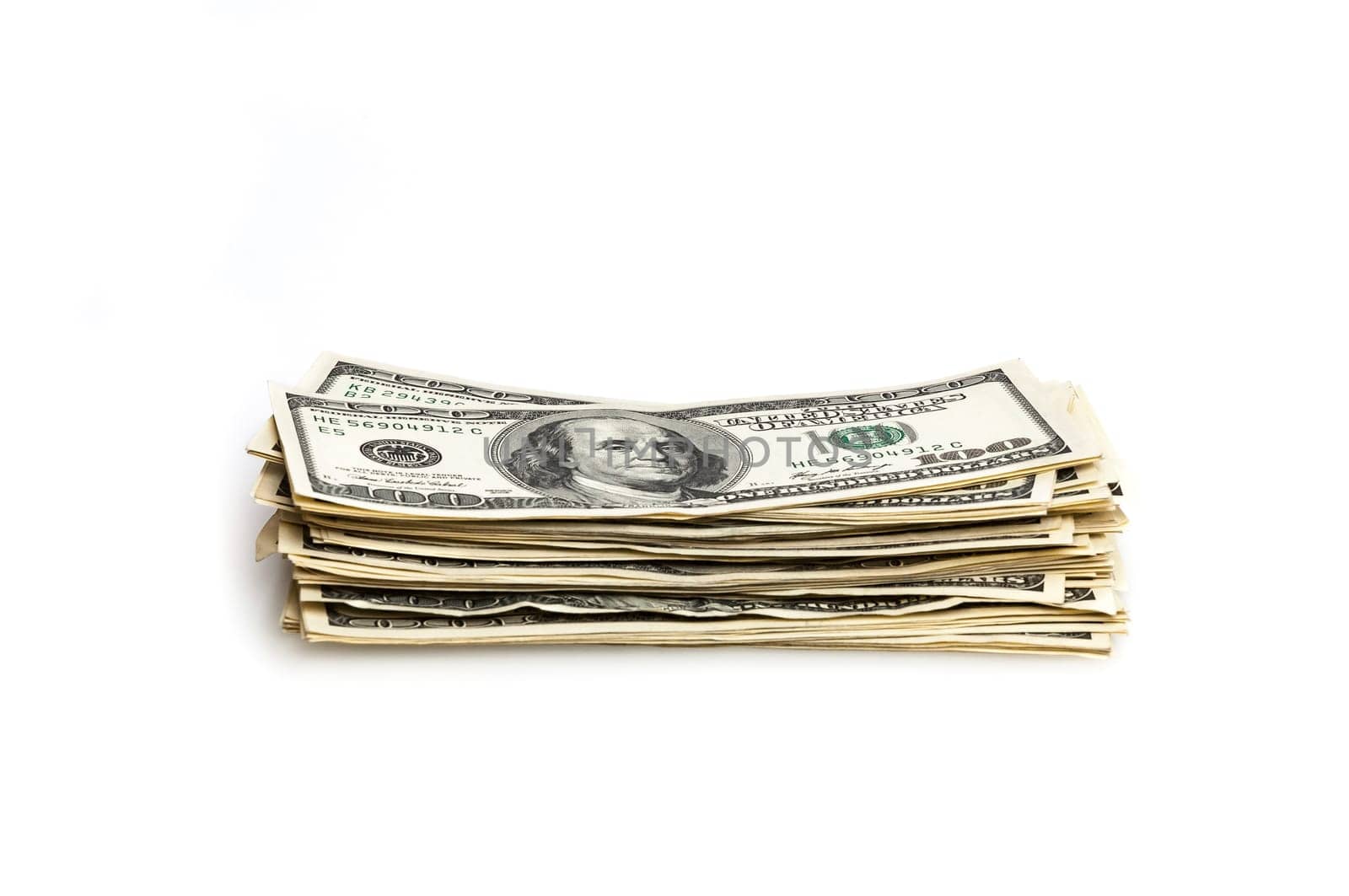 A stack of one hundred dollar bills on a white background. Isolated.