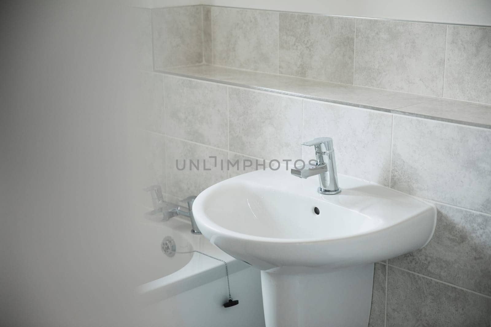 Close up shot of a bathroom sink in a new home.