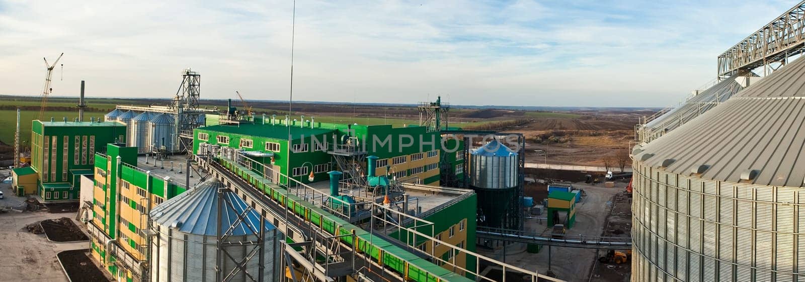 Towers of grain drying enterprise. metal grain facility with silos