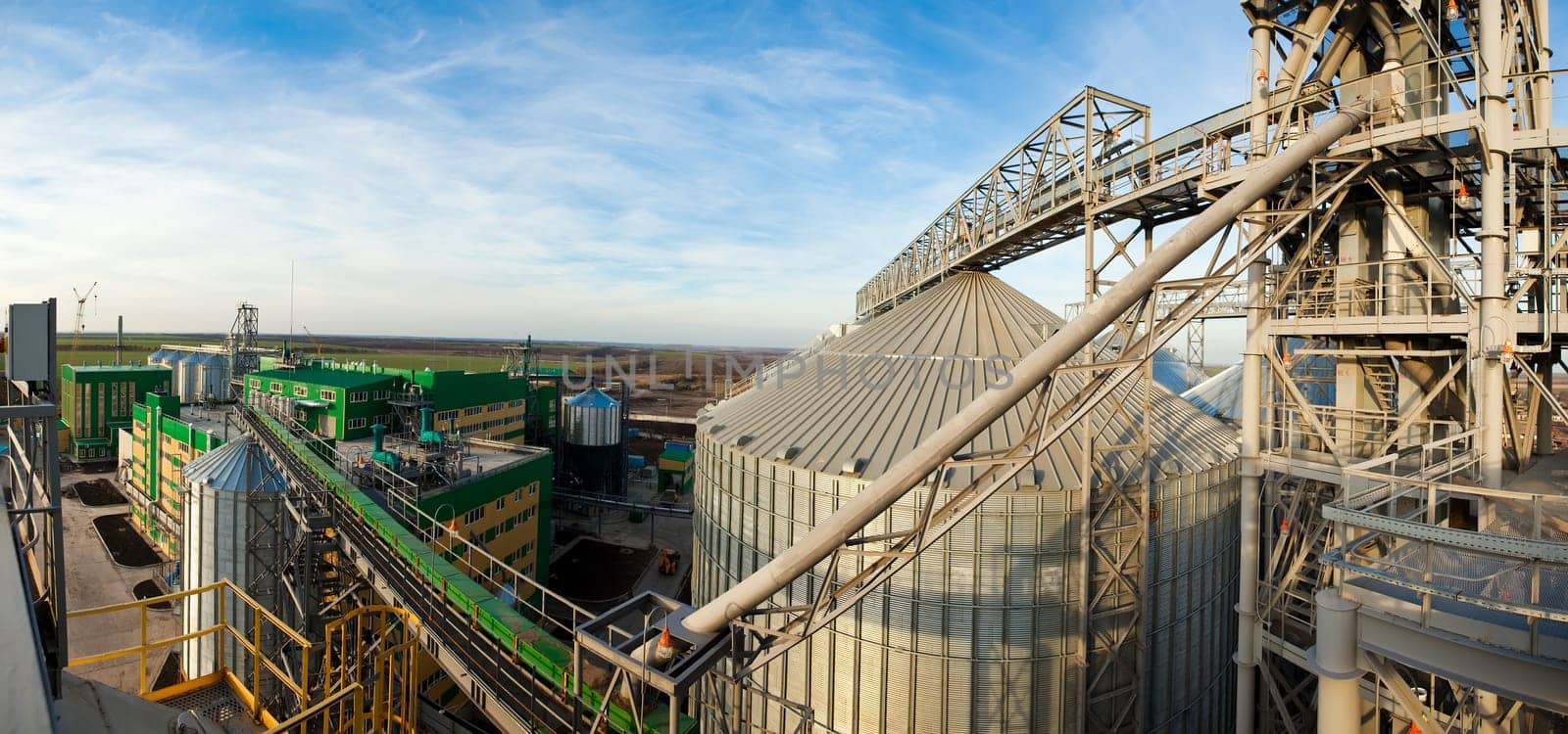 Towers of grain drying enterprise. metal grain facility with silos