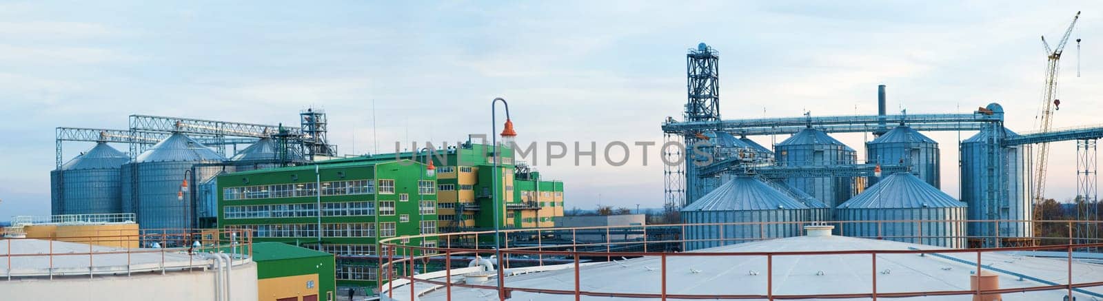 Towers of grain drying enterprise. metal grain facility with silos