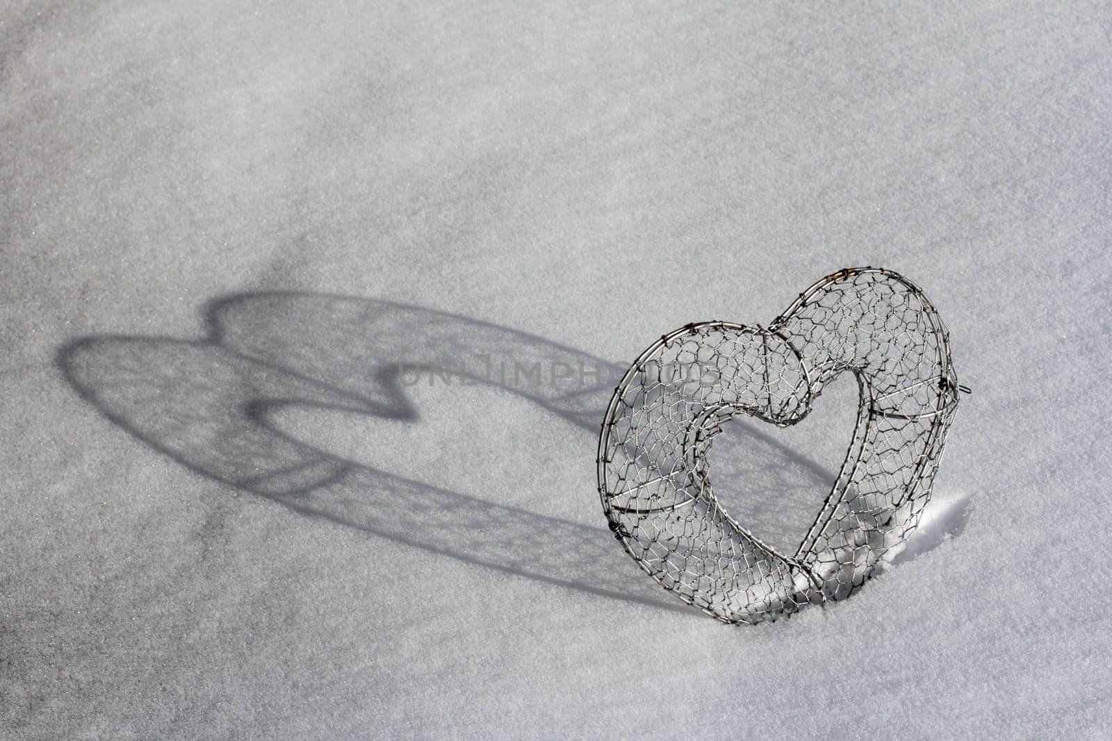 A heart with shade in the snow