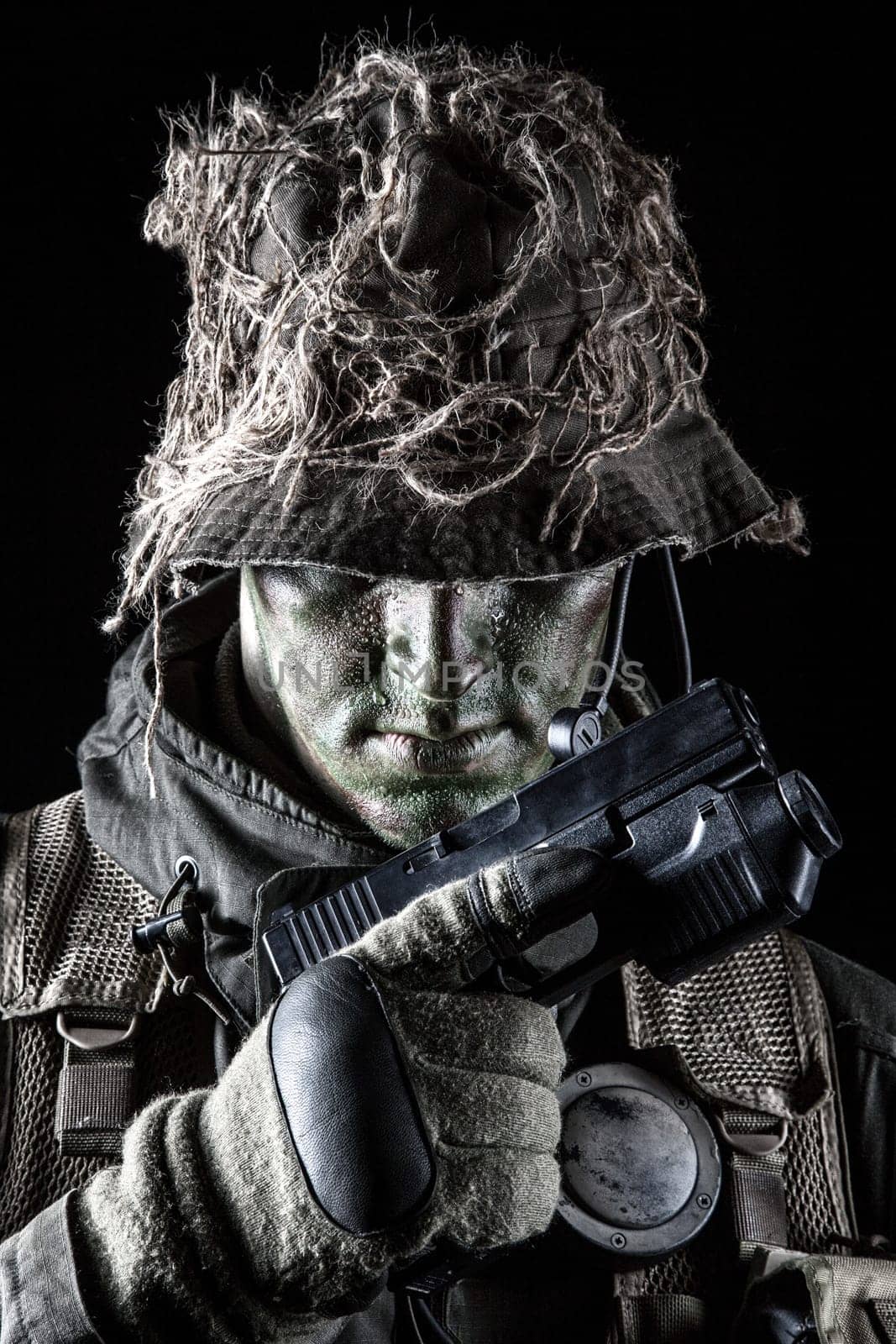 Jagdkommando soldier Austrian special forces with pistol on dark background