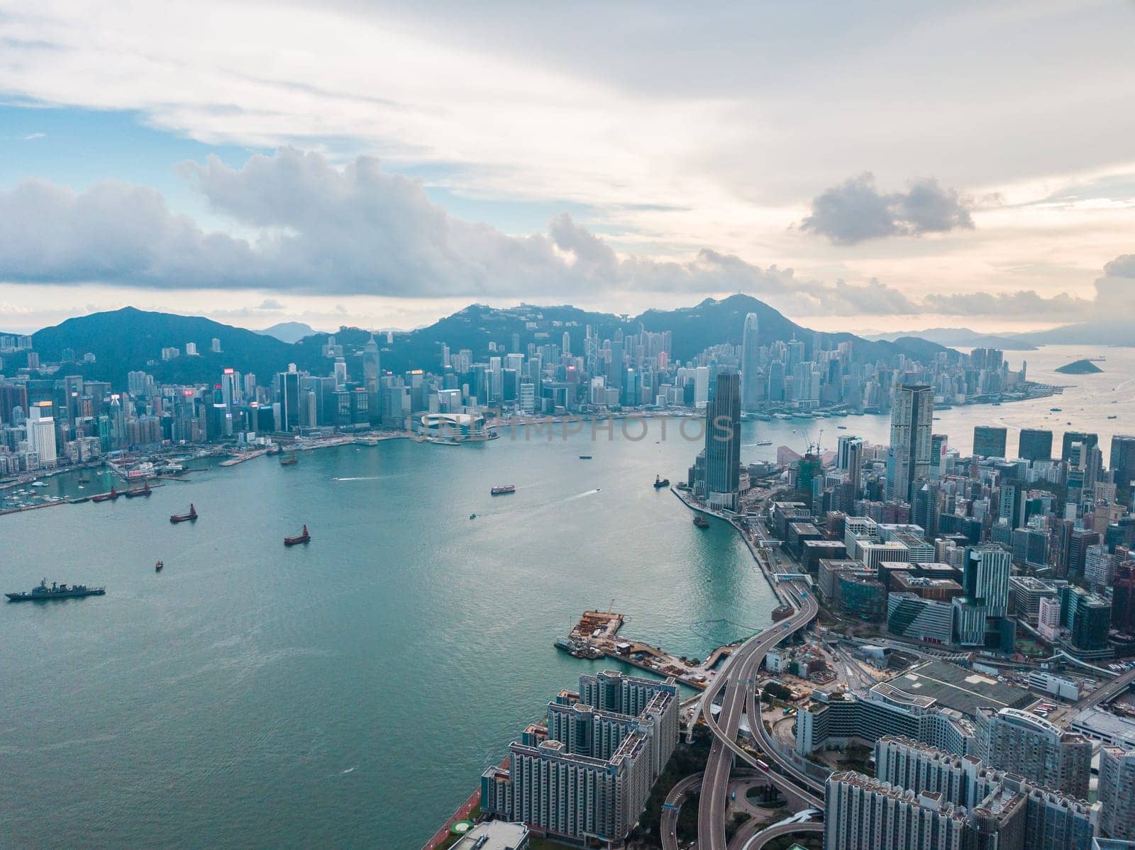 Top view aerial photo from flying drone of a HongKong Global City with development buildings, transportation, energy power infrastructure. Financial and business centers in developed China town