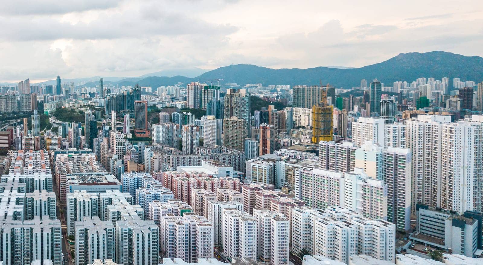 Top view aerial photo from flying drone of a HongKong Global City with development buildings, transportation, energy power infrastructure. Financial and business centers in developed China town