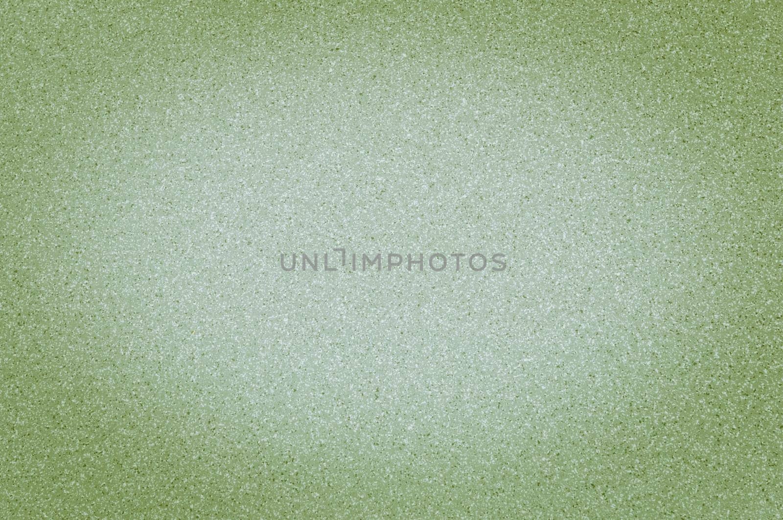 Texture of granite light green color with small dots, with vignetting.