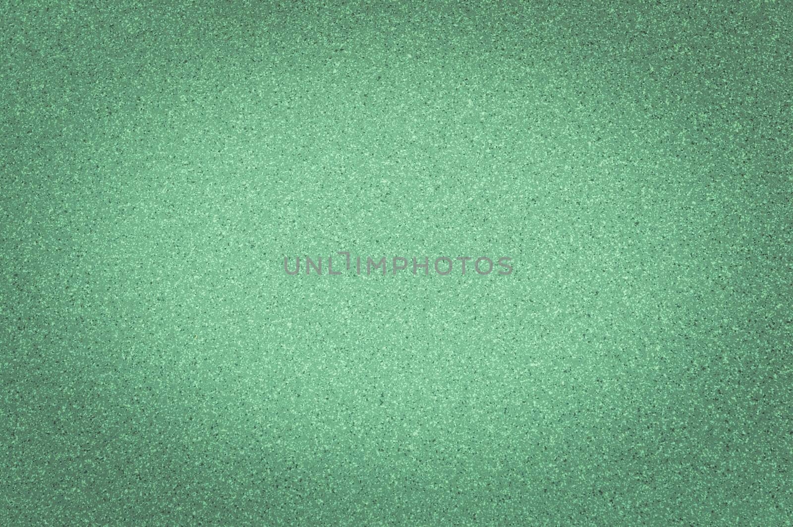 Texture of granite green color with small dots, with vignetting.
