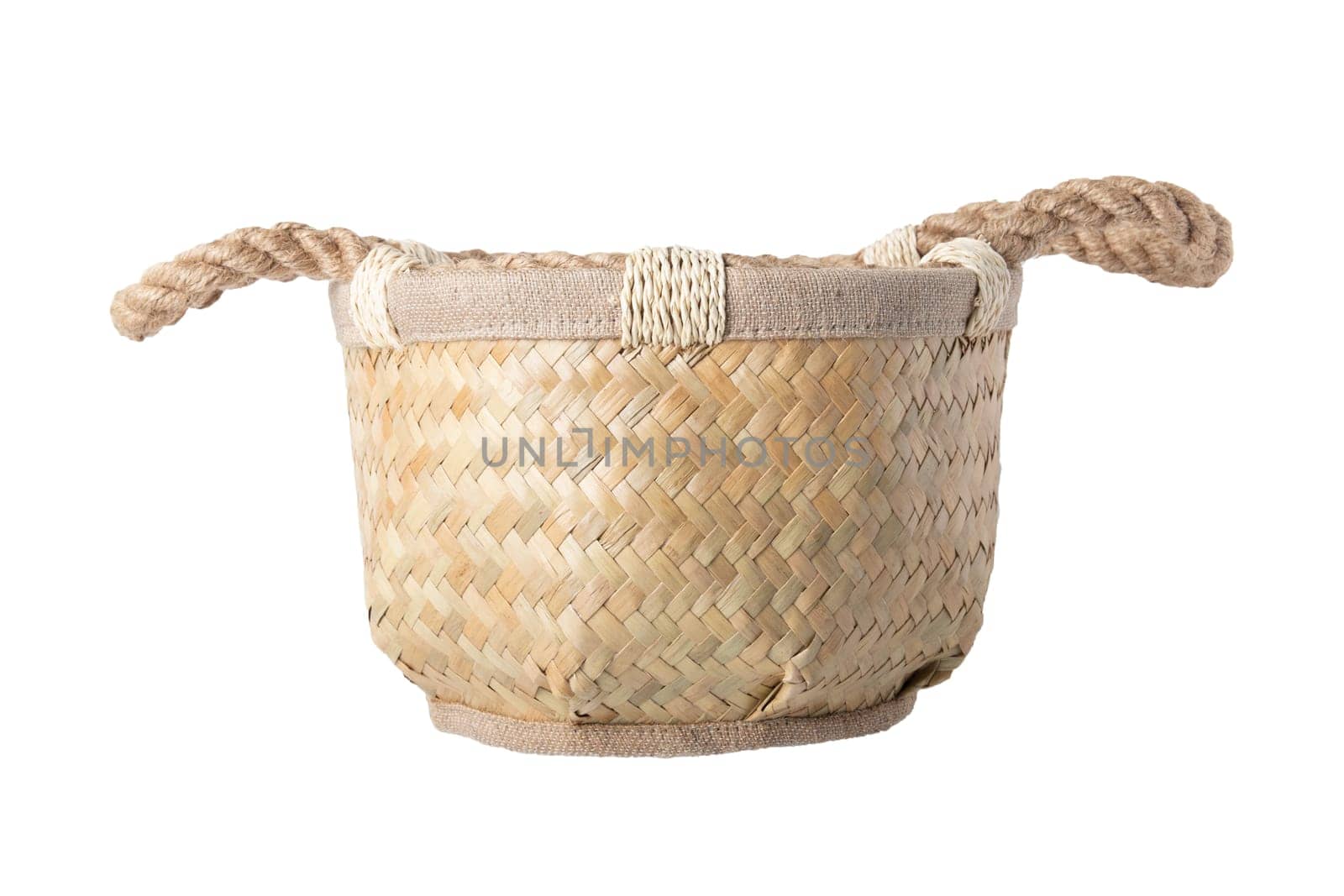 Empty straw basket with handles of rope isolated on white background. For your food and product display montage.
