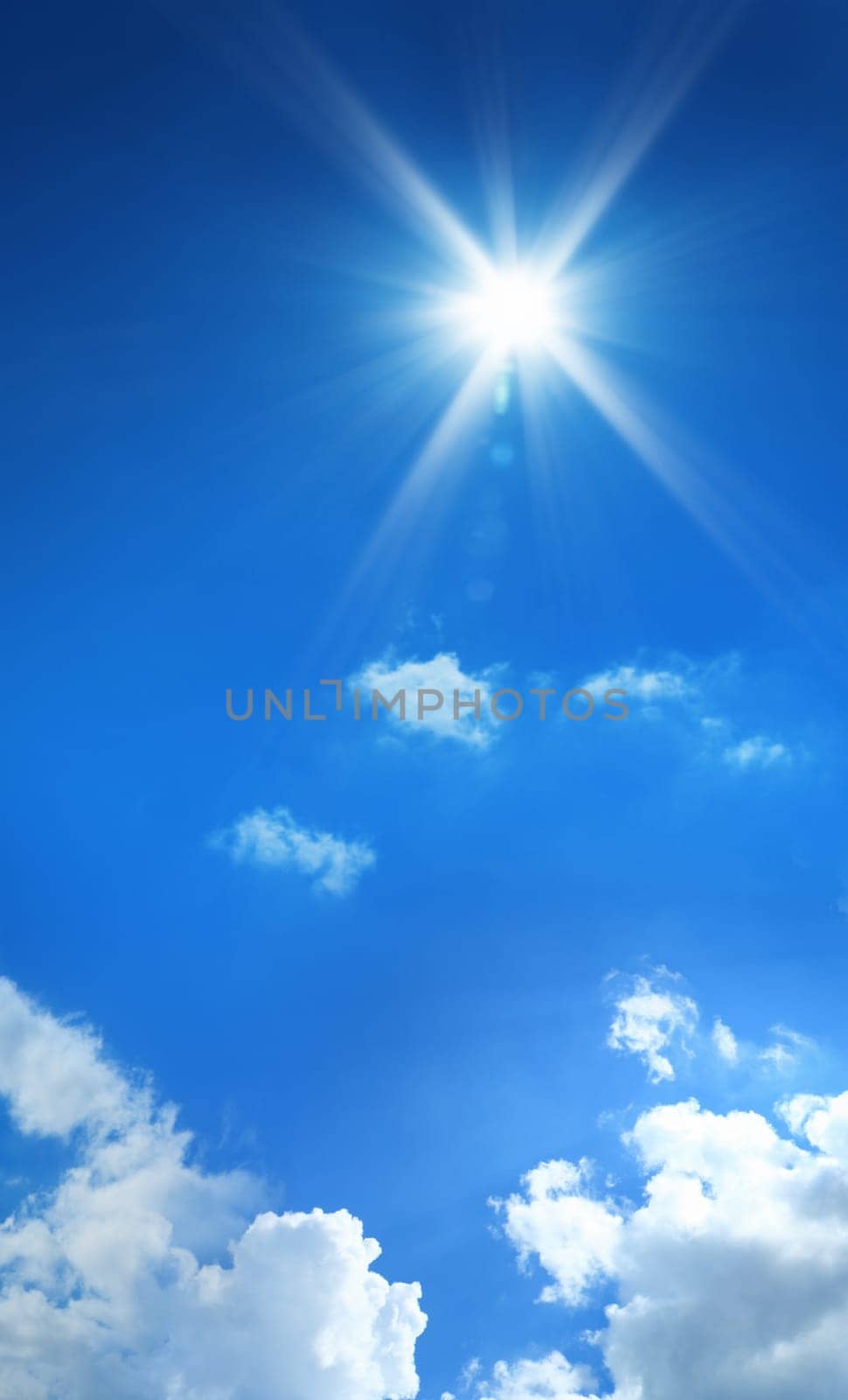 conceptual background image of blue sky with clouds and shining sun