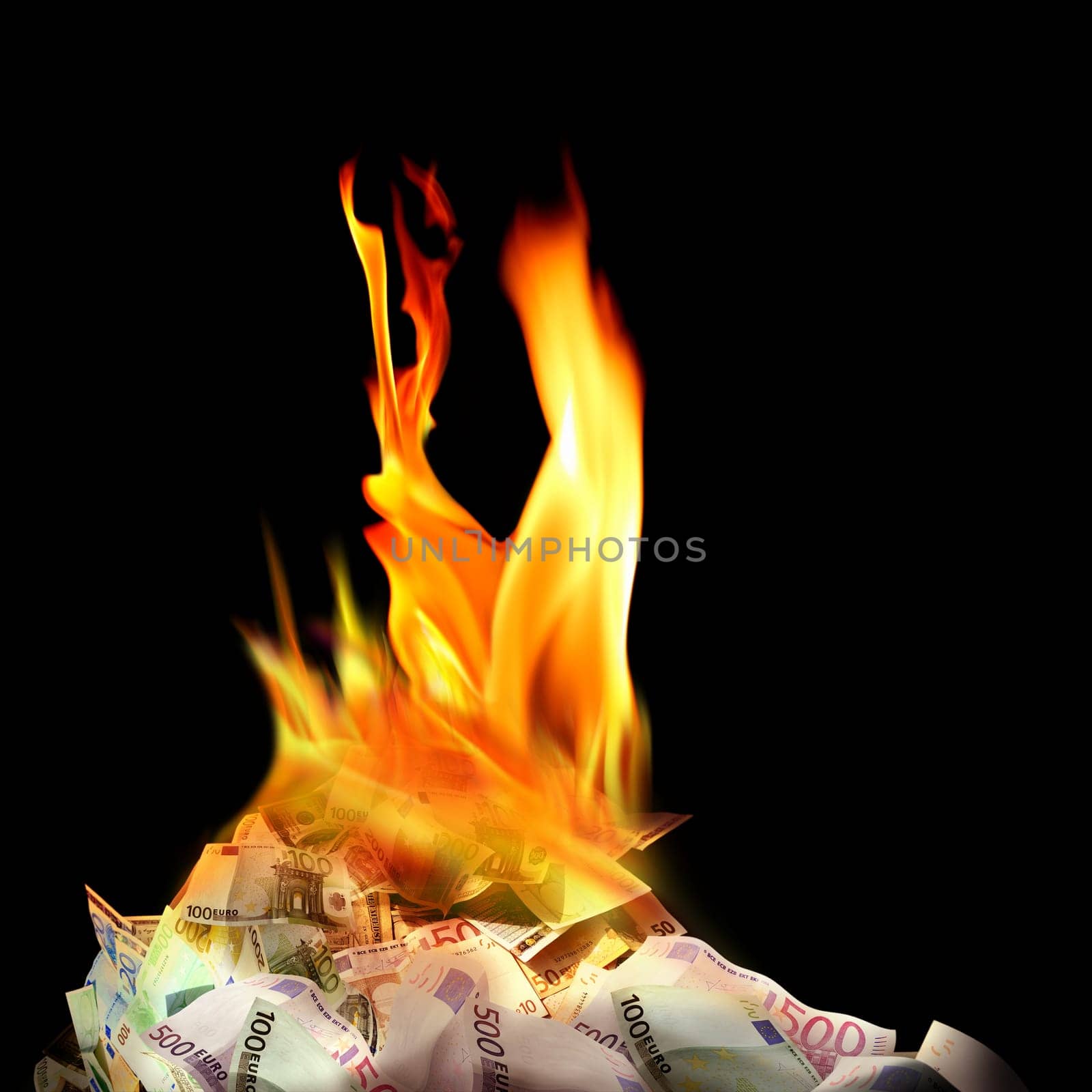 Conceptual finance image of burning pile of money, dollar and euro bills, with fire flames in black background