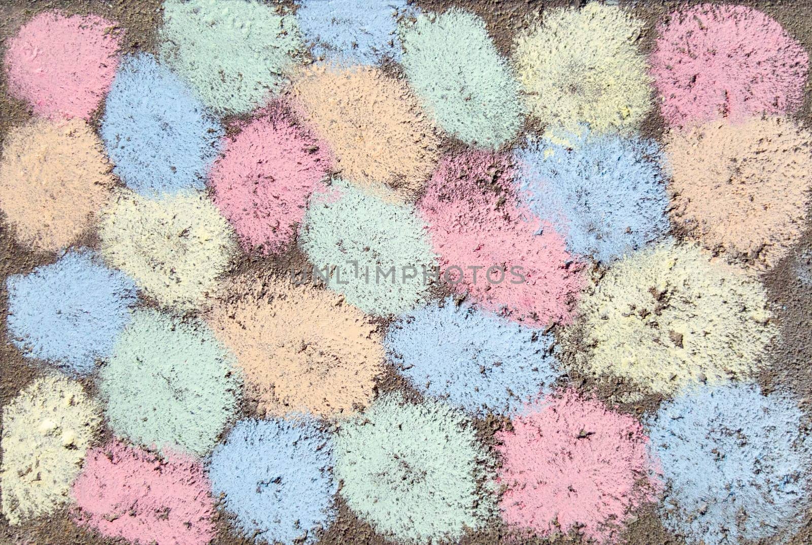 Drawing with colorful chalk on pavement