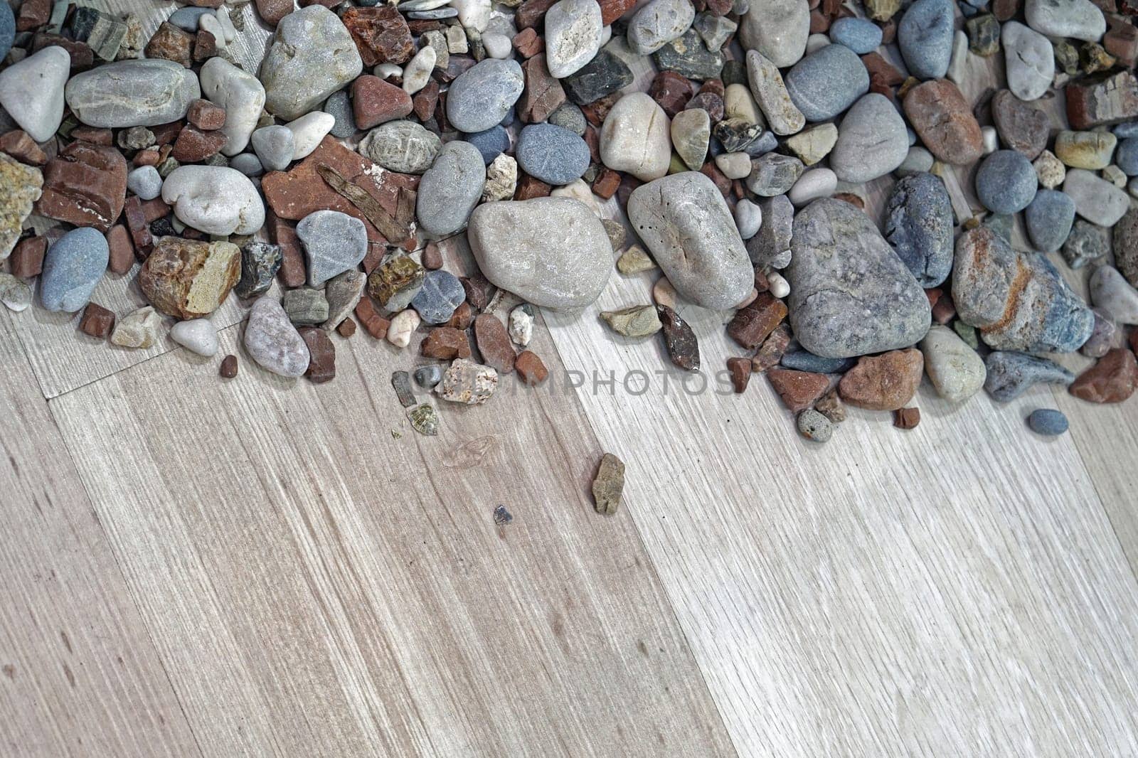 Rocks and stones at wood background decor