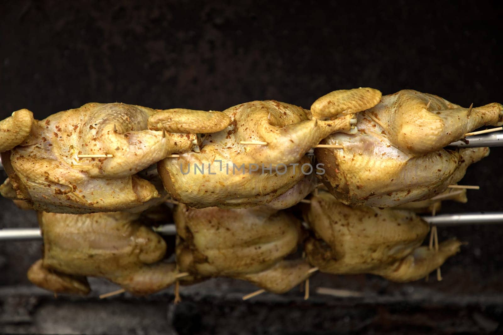 close up chickens grilled in arow in street of Bangkok, Thailand