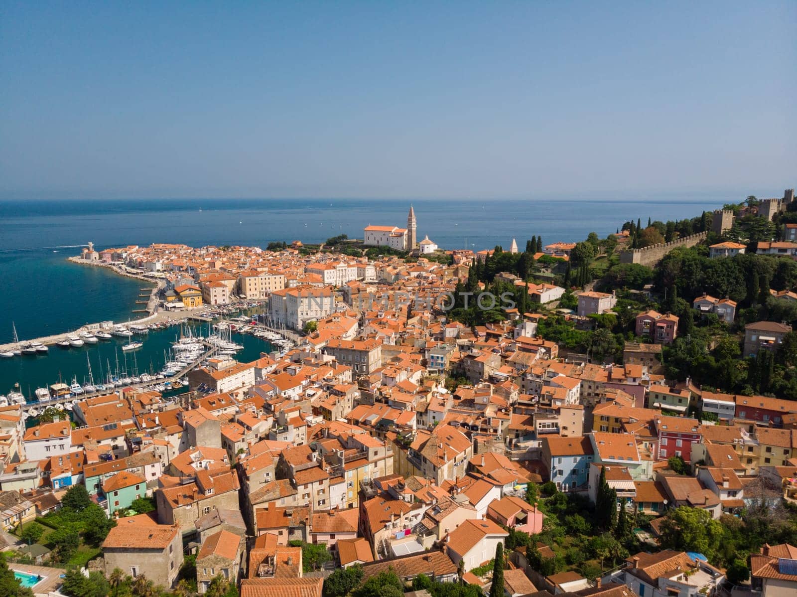 Aerial view of old town Piran. Splendid summer day on Adriatic Sea. Beautiful cityscape of Slovenia, Europe. Traveling concept background. Magnificent Mediterranean landscape.