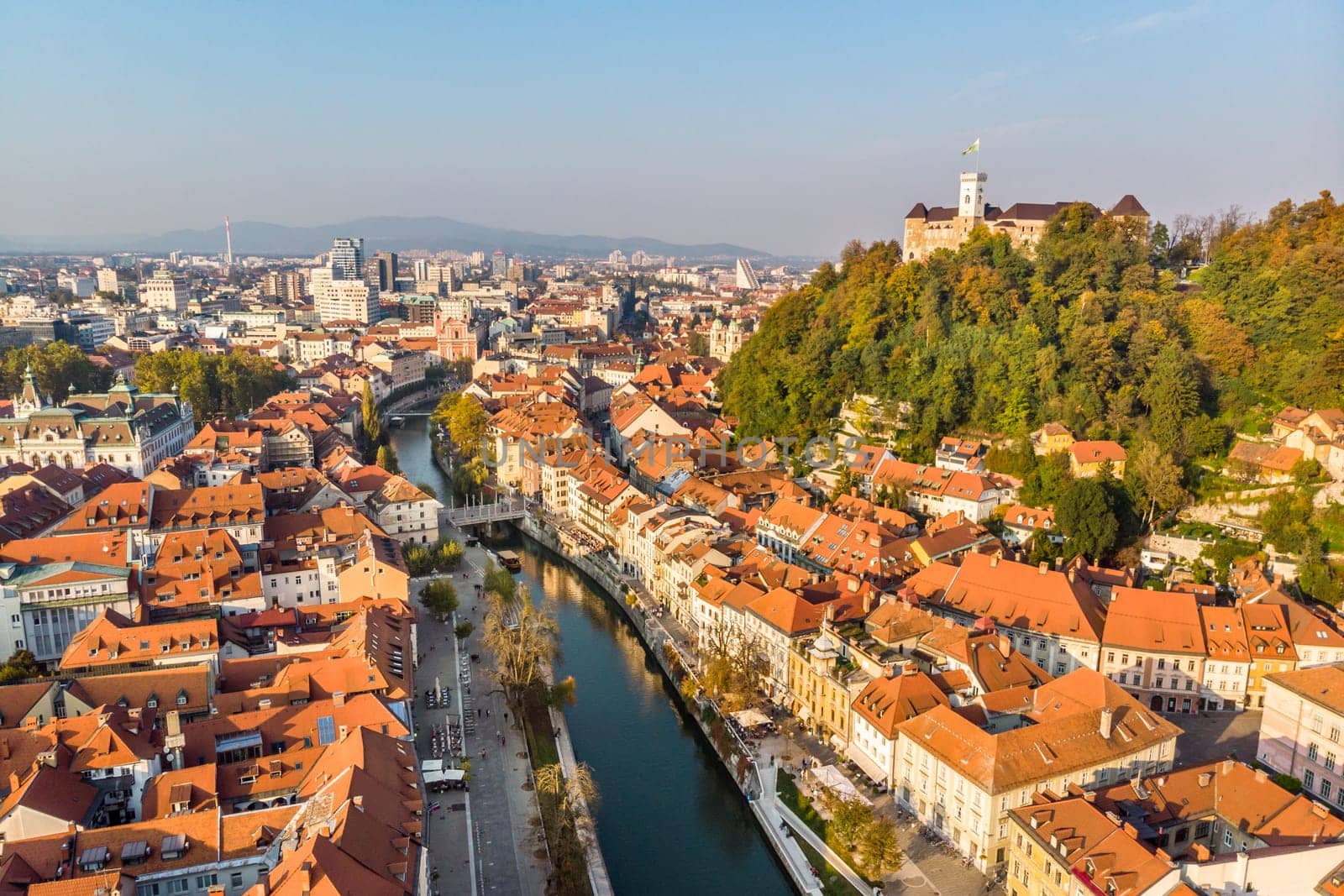Aerial panoramic view of Ljubljana, capital of Slovenia in warm afternoon sun.