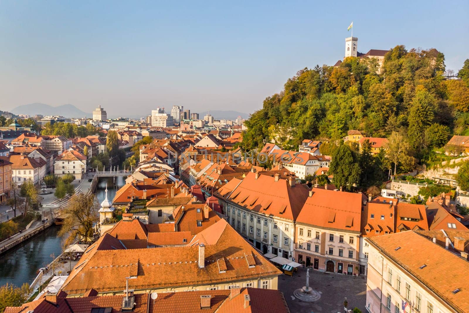 Aerial panoramic view of Ljubljana, capital of Slovenia in warm afternoon sun.