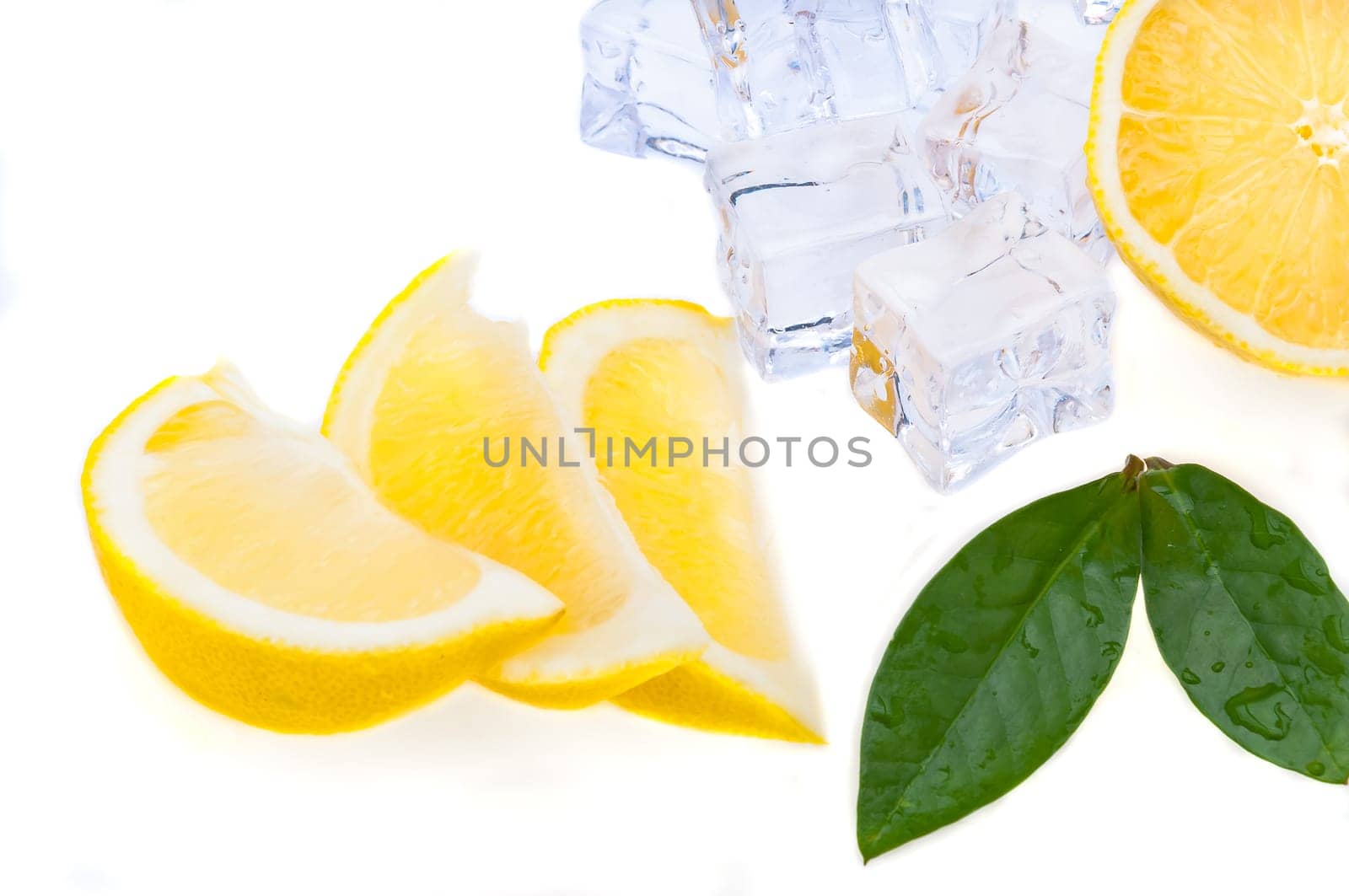 Three slices of fresh, bright juicy lemon with green leaves and cubes of cold ice, on a white background.
