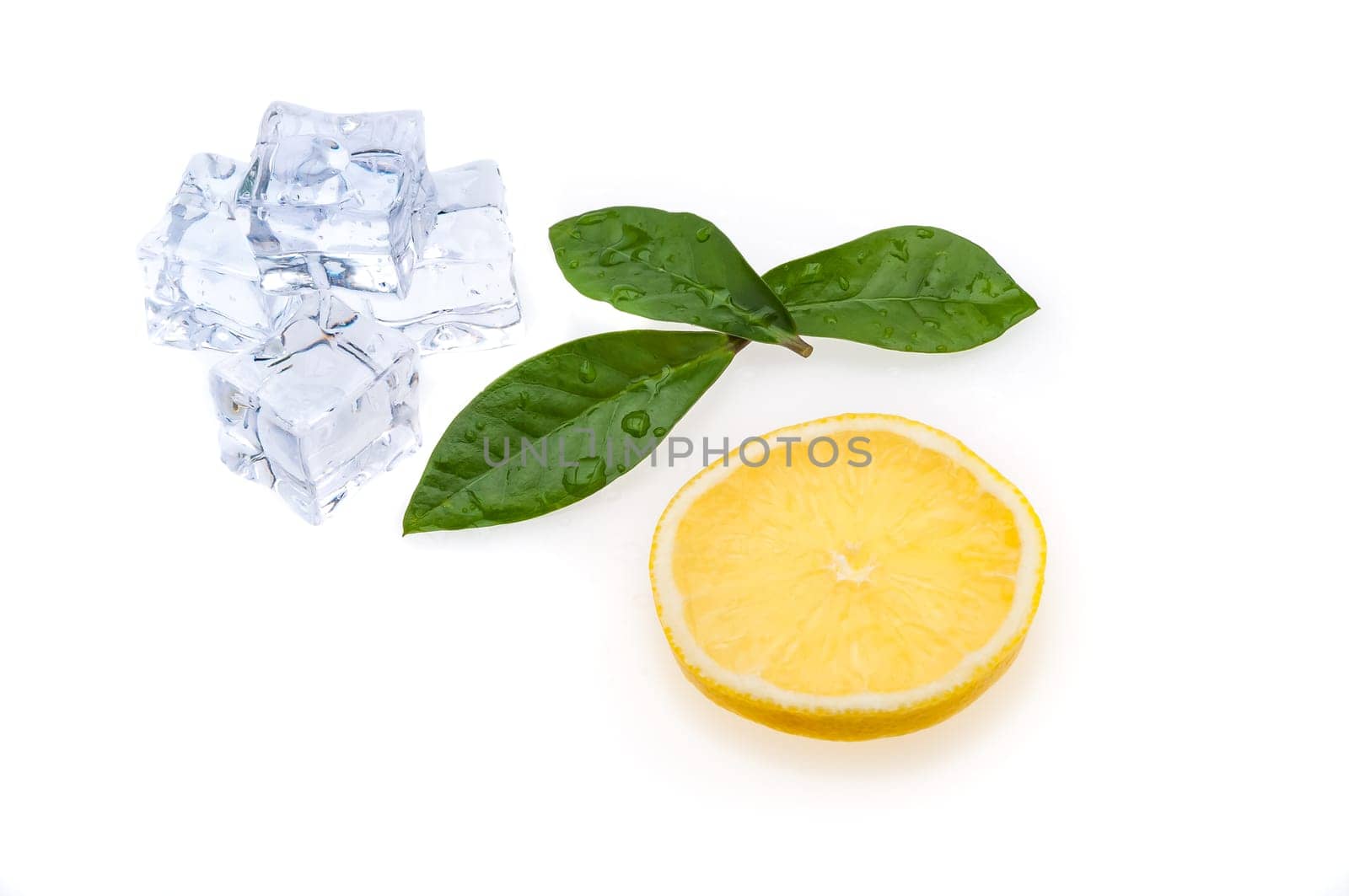 Round slice of bright, fresh, juicy lemon and few green leaves and ice cubes on a white background.