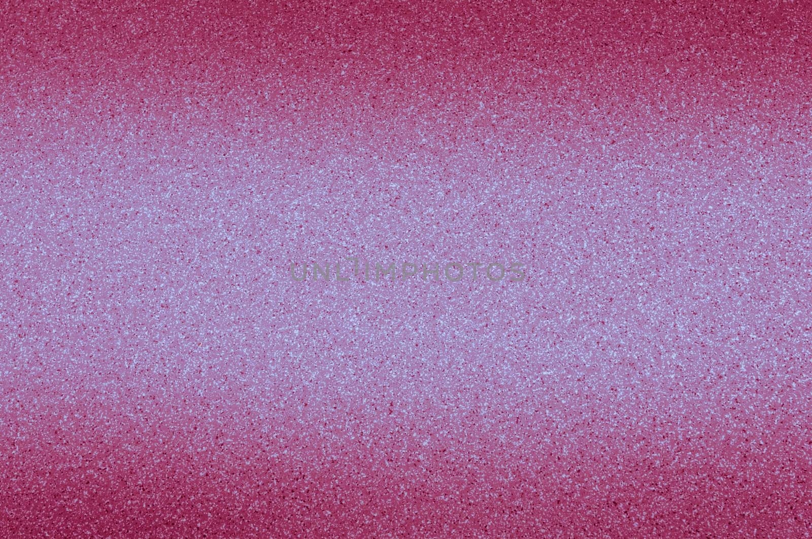 Granite background of pink color with small dots.