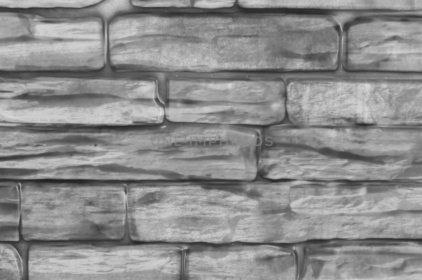 Wall of bricks close-up black and white.