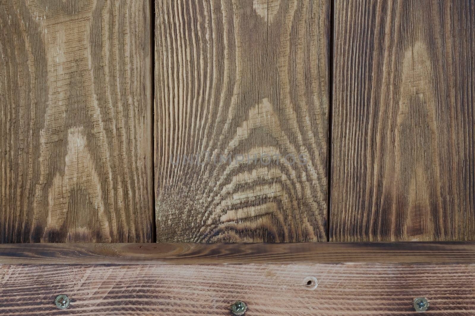 Textural background of wooden boards and one horizontal board.