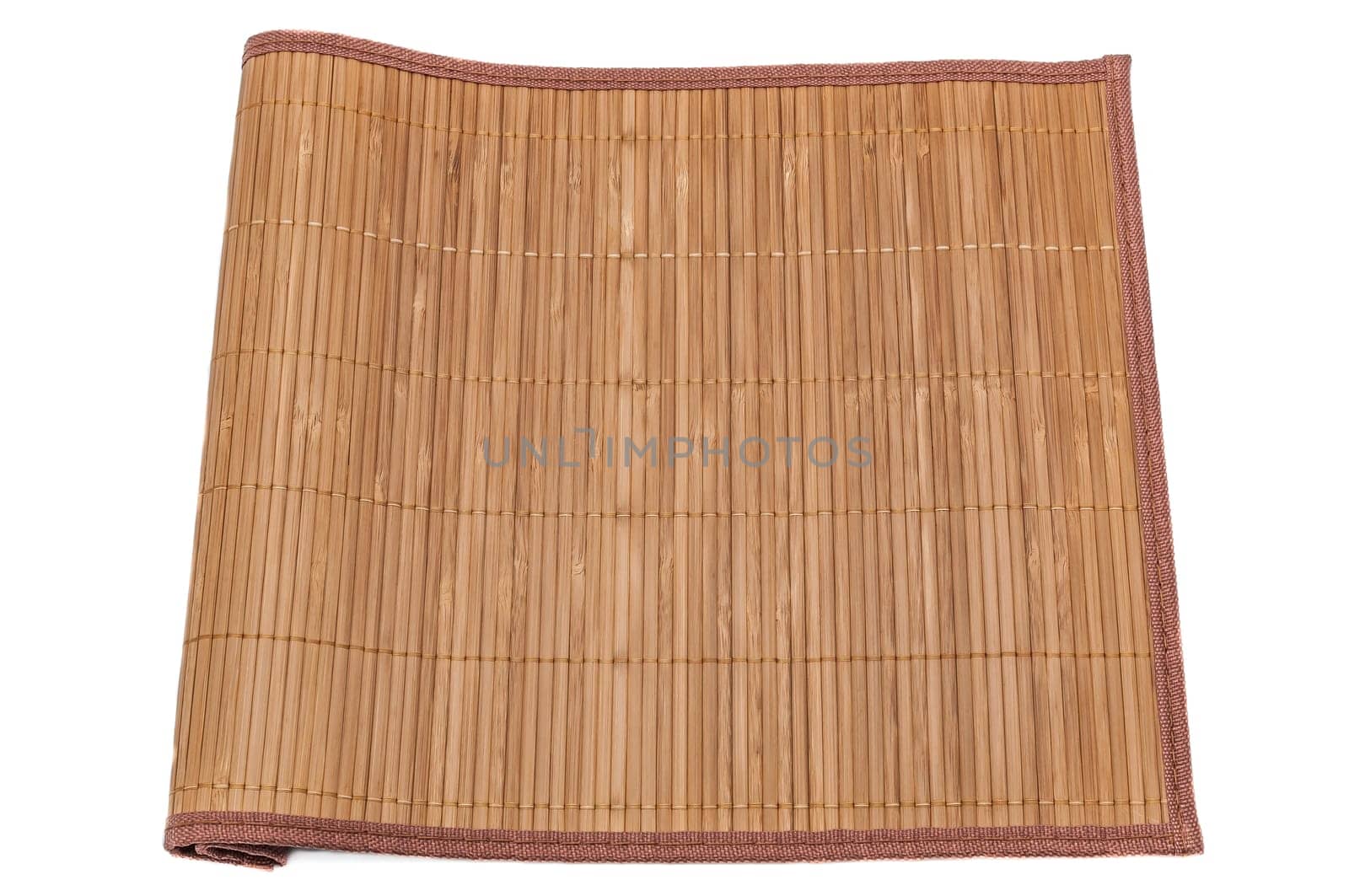 Bamboo mat on white background, close-up, tucked on one side.