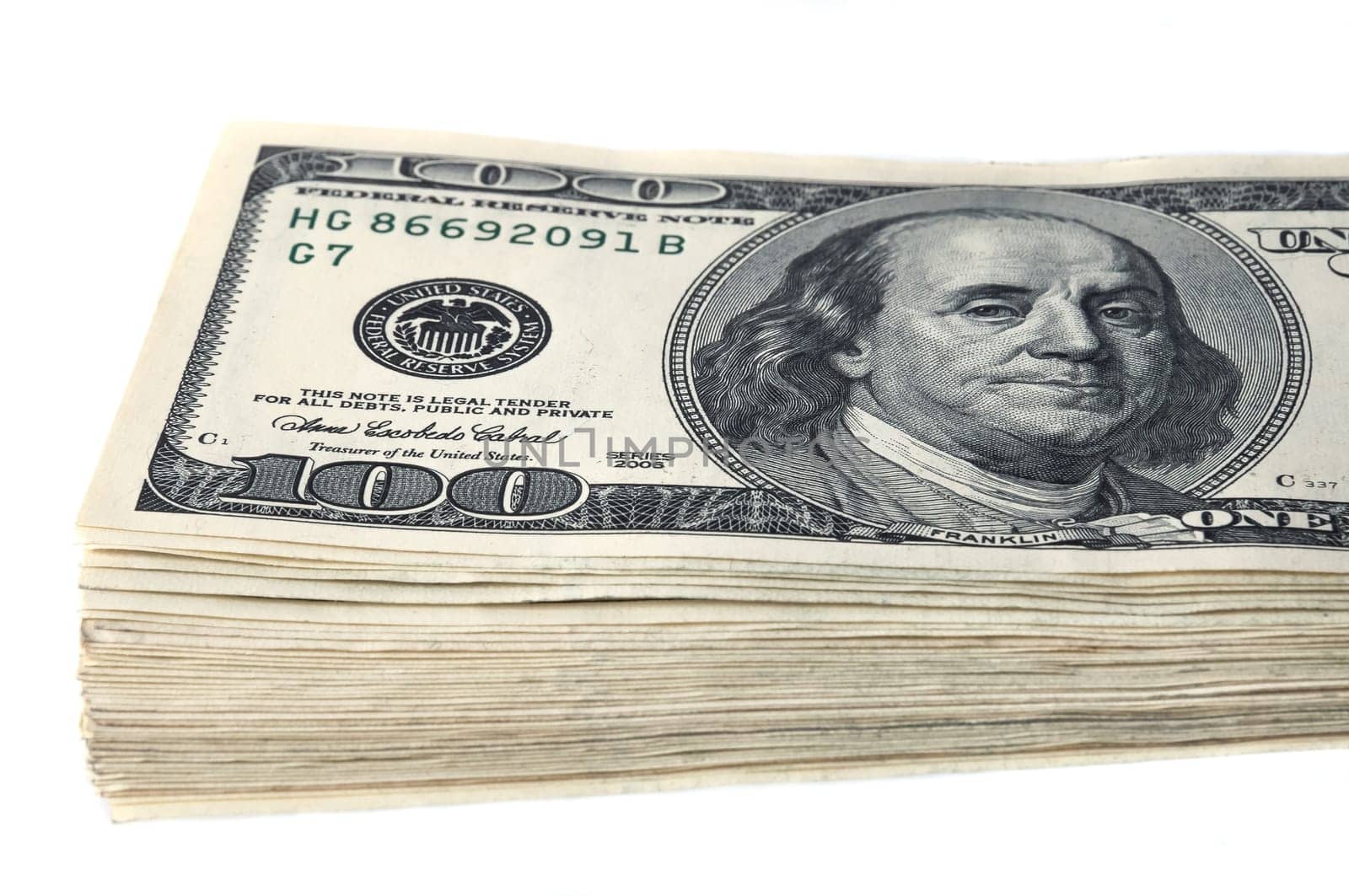 A stack of one hundred dollar bills on a white background.
