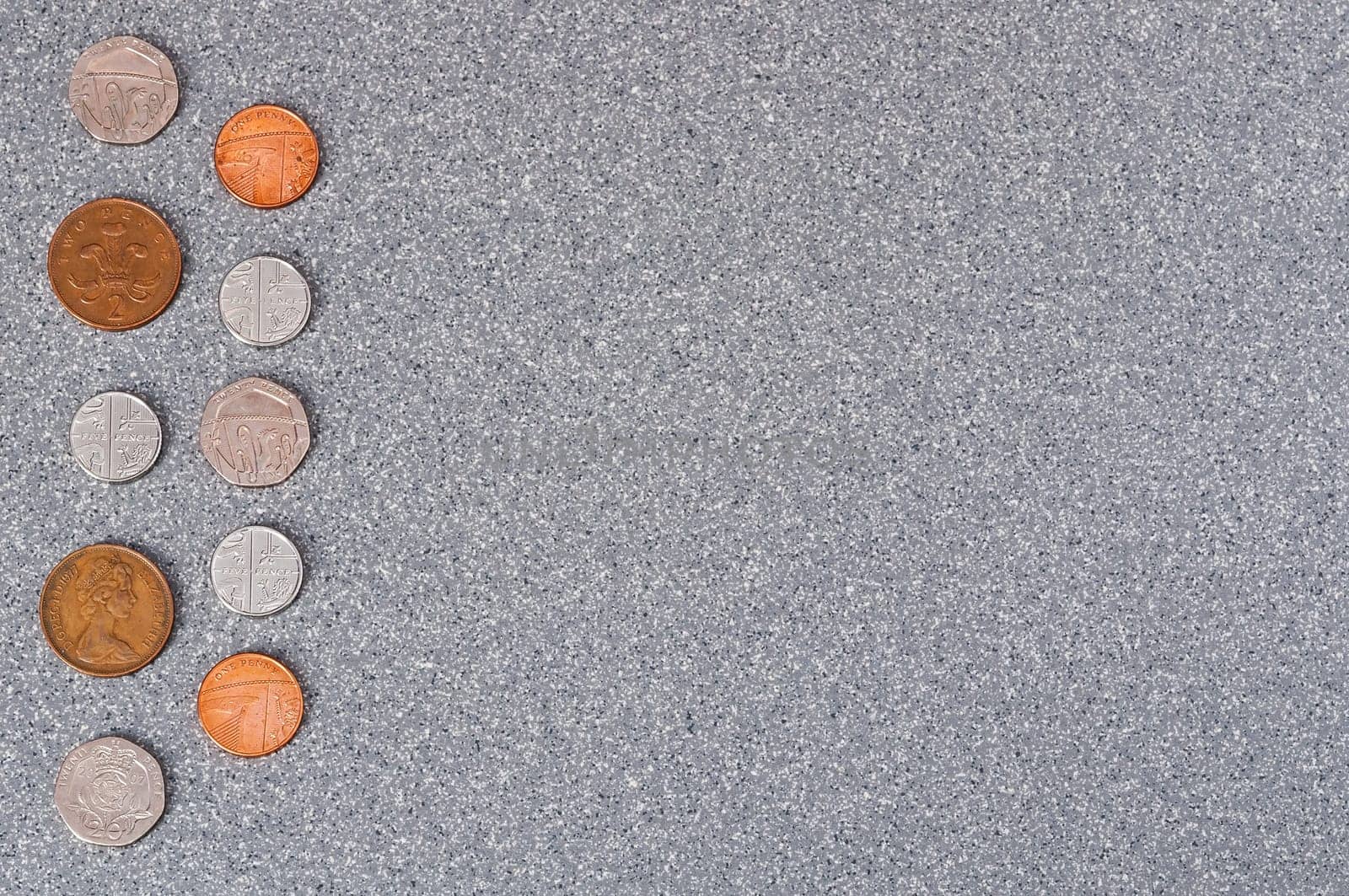 Coins of Great Britain on a background of granite.