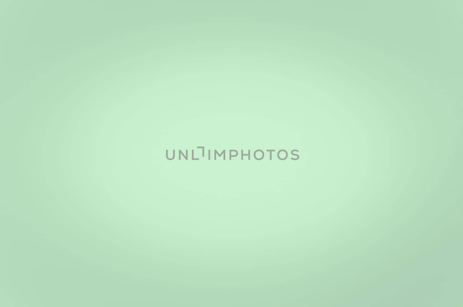 Blurred background light green color. Enlightenment in the center. No texture.