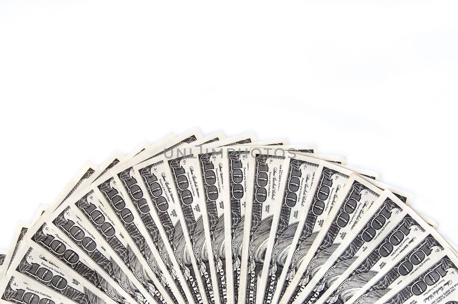 A fan of one hundred dollar bills on the long side. White background.