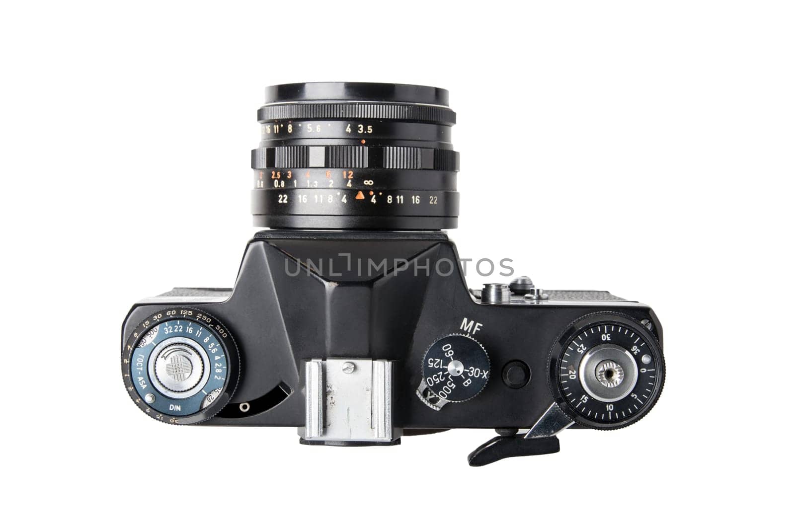 Camera isolated. Top view on a old film mirror SLR camera isolated on a white background. Concept vintage and retro.