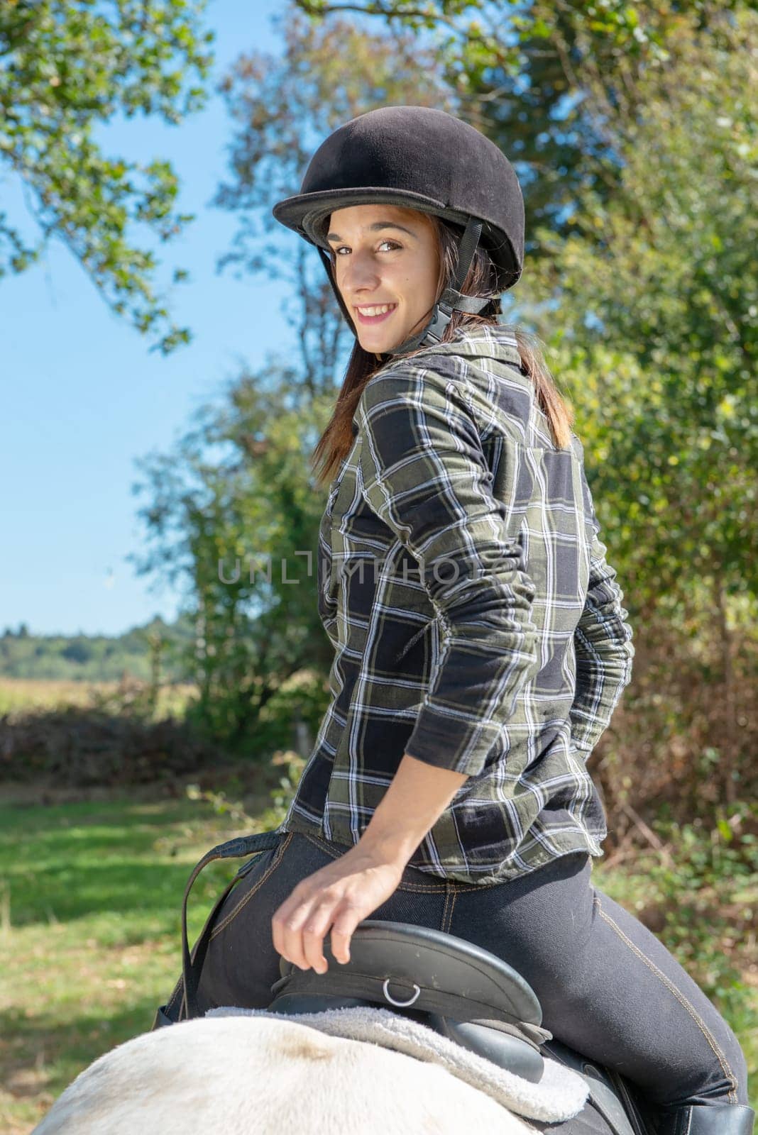 a portrait of beautiful girl on horseback