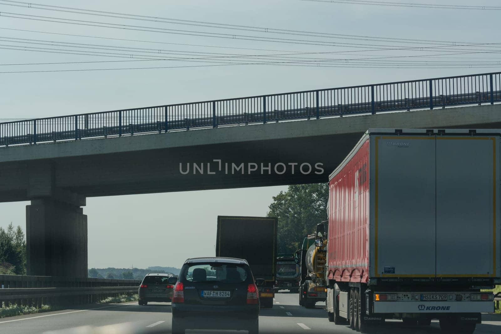 UNNA, GERMANY - AUGUST 23, 2017: Traffic on the A2 motorway and Scholven coal power station, Germany, North Rhine-Westphalia.