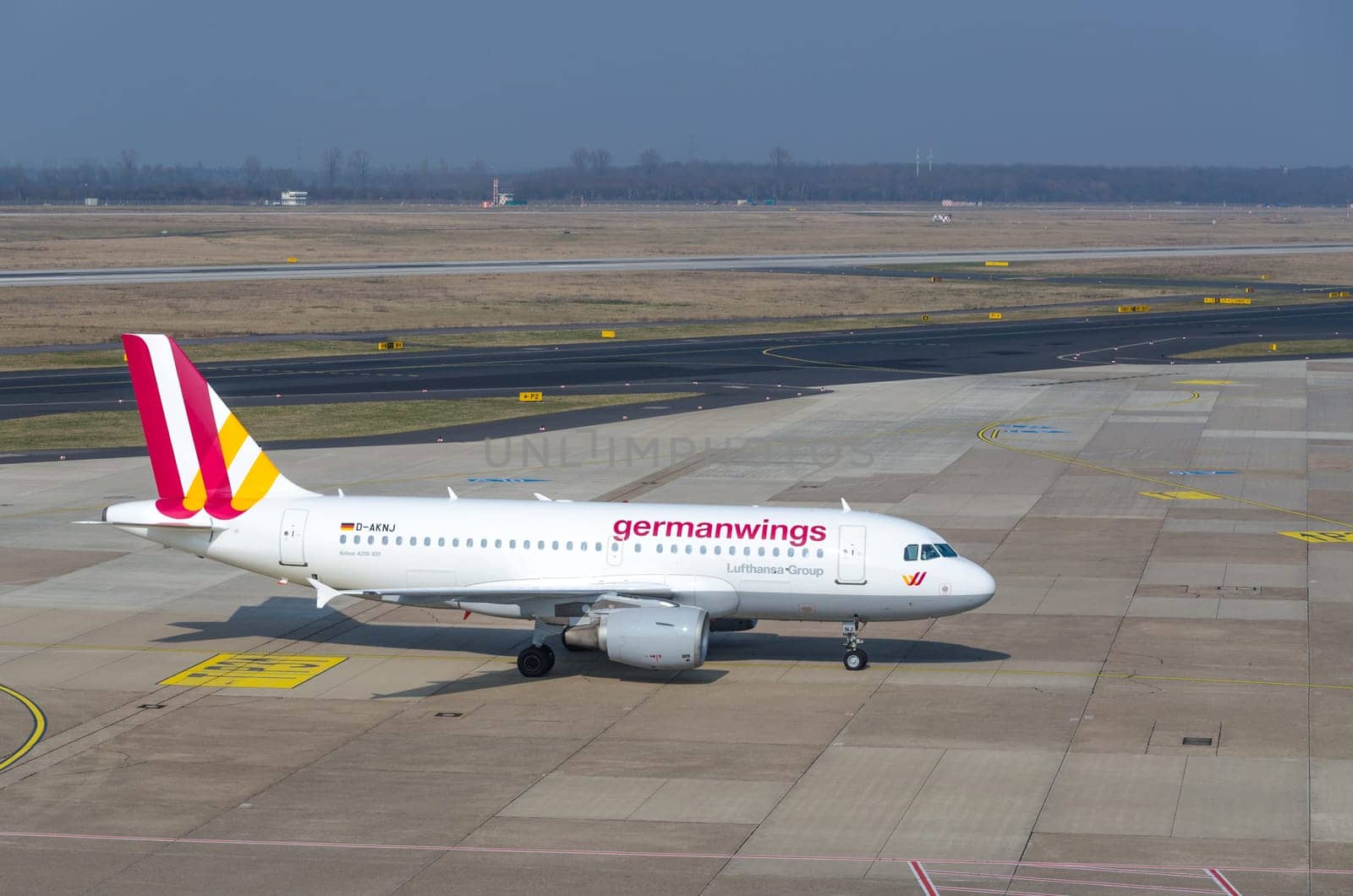 DUSSELDORF, NRW, GERMANY - MARCH 18, 2015:: Up, Airplane Dusseldorf. View of the tarmac. Large passenger airplane at the gate.