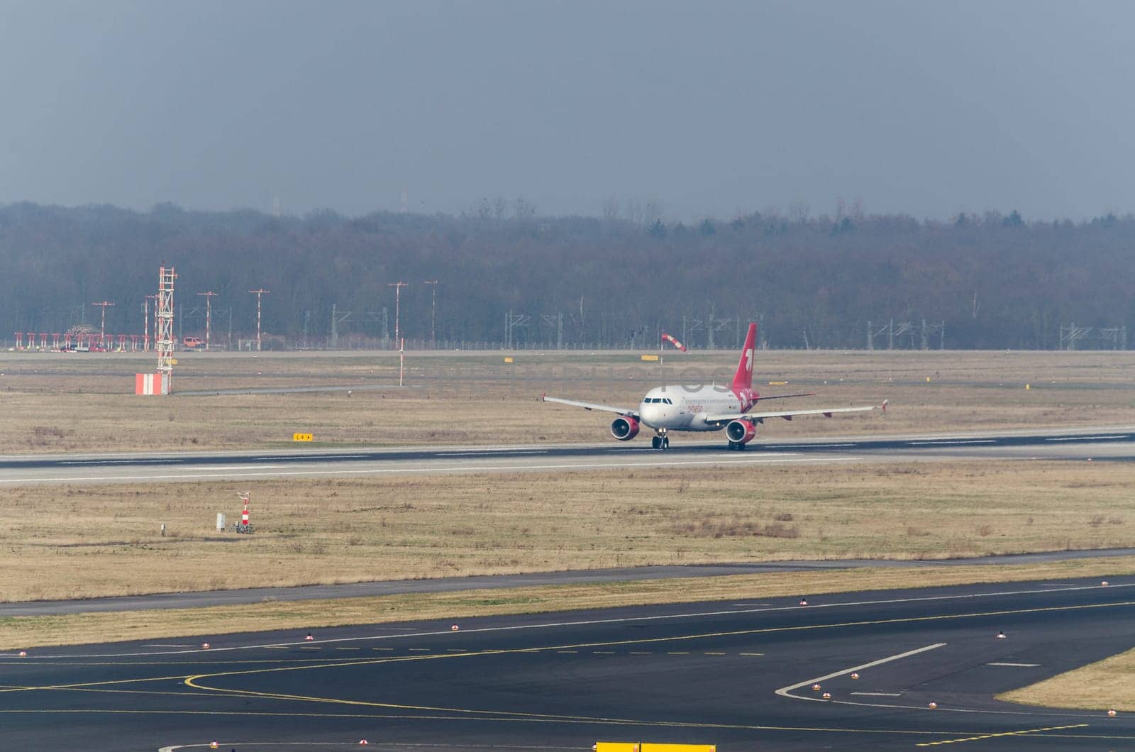 Duesseldorf, Nrw, Germany - March 18, 2015: Up, Airplane Dusseldorf. View of the tarmac. Large passenger airplane at the gate.