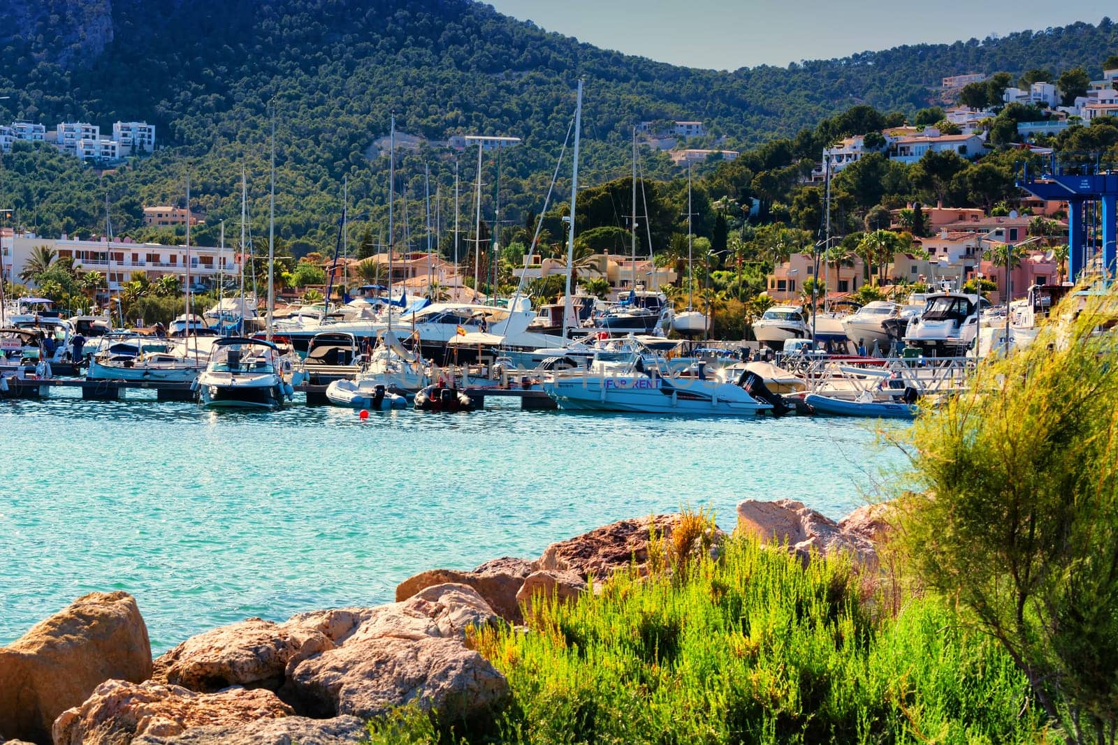 PORT ANDRATX, SPAIN - JUNE 01, 2017:.View of the Bay of Port Andratx Mallorca Baleares Spain. In the background motor boats and sailboats.