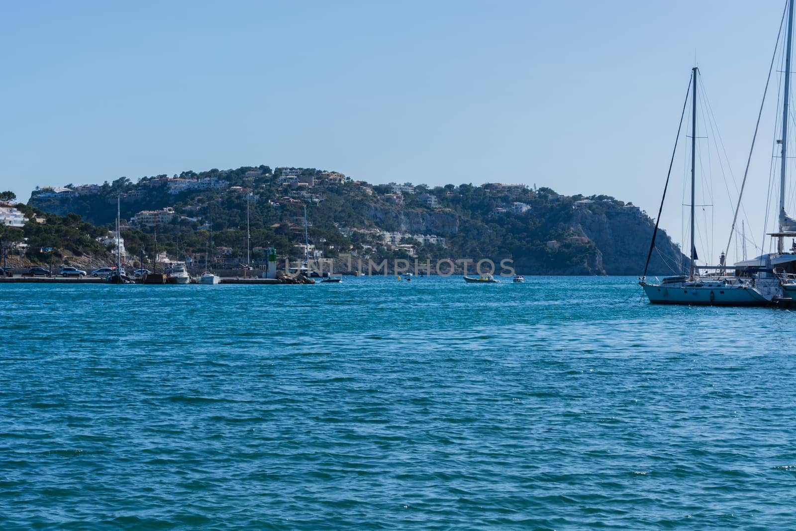 PORT ANDRATX, SPAIN - JUNE 01, 2016:.View of the Bay of Port Andratx Mallorca Baleares Spain. In the background motor boats and sailboats.