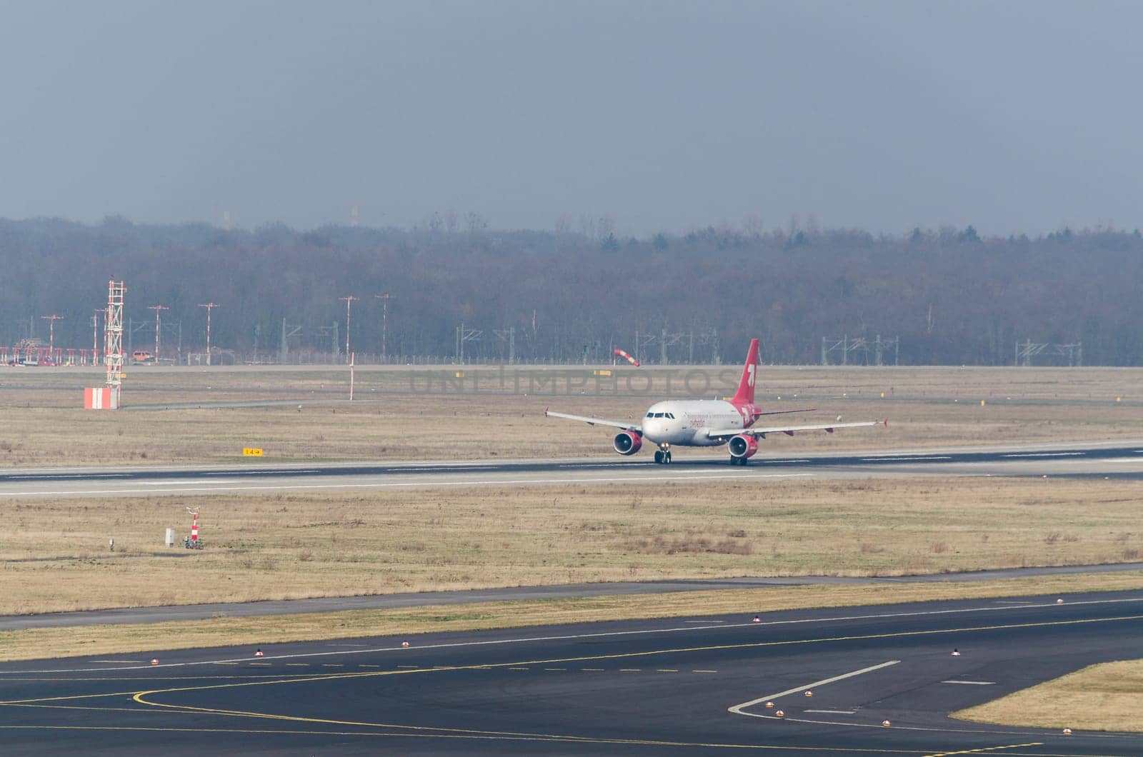 Dusseldorf, Nrw, Germany - March 18, 2015: Up, Airplane Dusseldorf. View of the tarmac. Large passenger airplane at the gate.