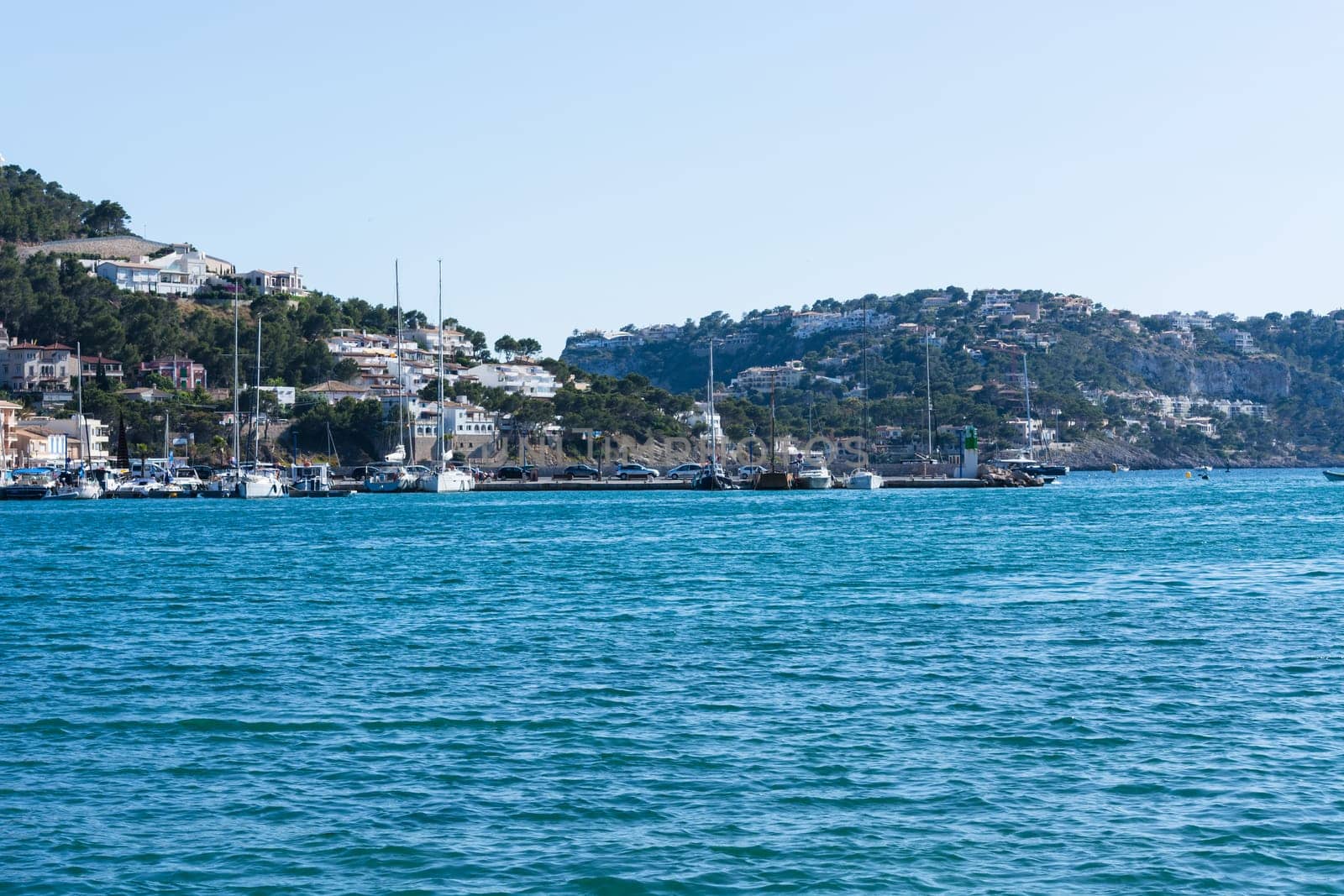 PORT ANDRATX, SPAIN - JUNE 01, 2016:.View of the Bay of Port Andratx Mallorca Baleares Spain. In the background motor boats and sailboats.