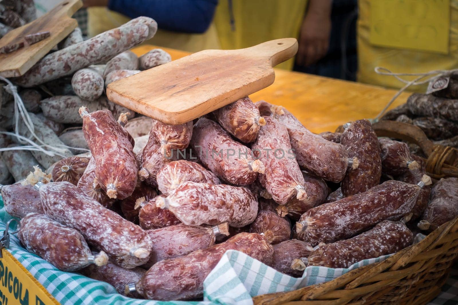 Many salamis  for sale at the local market in Italy