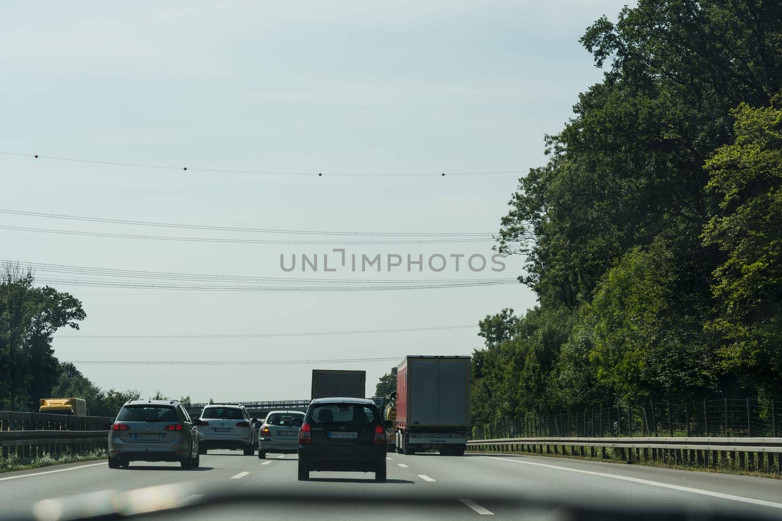 UNNA, GERMANY - AUGUST 23, 2017: Traffic on the A2 motorway and Scholven coal power station, Germany, North Rhine-Westphalia.