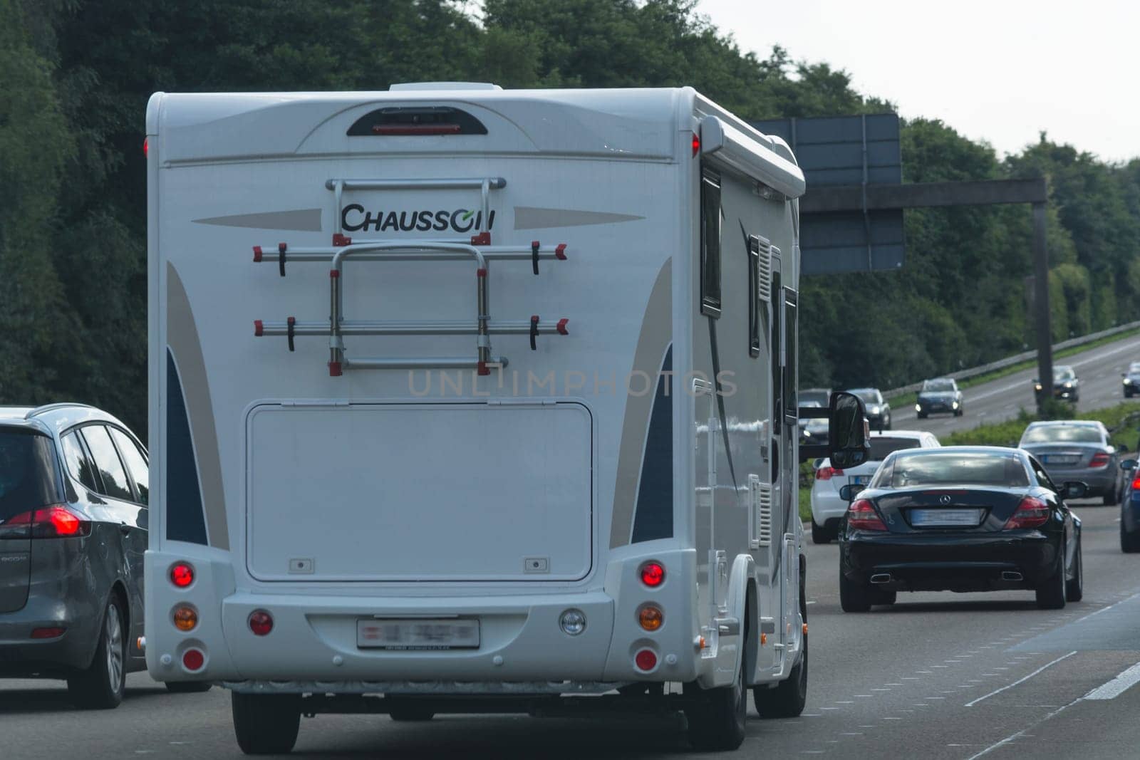 GRAFSCHAFT  GERMANY - AUGUST 13  2017:.Motorhome on the A 61 motorway in tourist traffic near the city Grafschaft. Vacation travel with the camper.