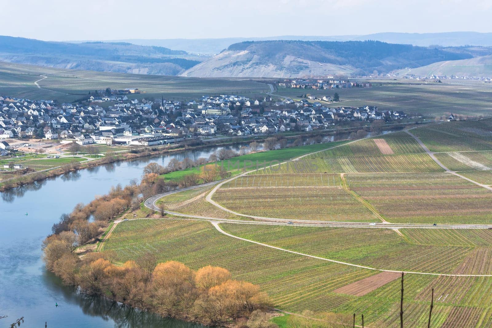 MOSELTAL, GERMANY - MARCH 26, 2016:.Panoramic view over the Moselle valley in the background the vineyards and the River Moselle.