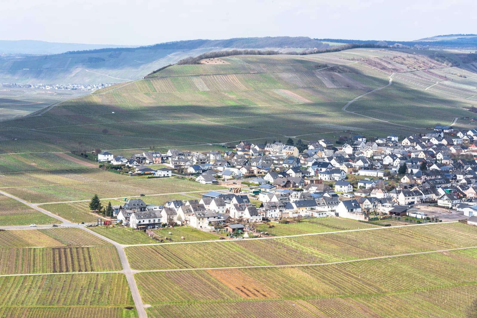 MOSELTAL, GERMANY - MARCH 26, 2016:.Panoramic view over the Moselle valley in the background the vineyards and the River Moselle.